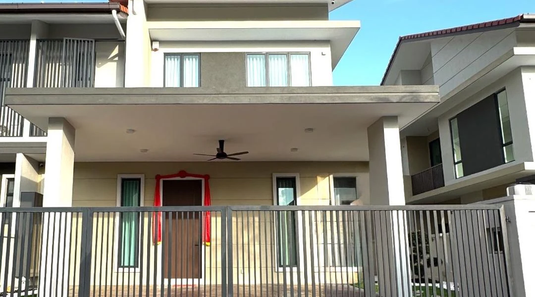 Two-storey house with a gated front and covered porch