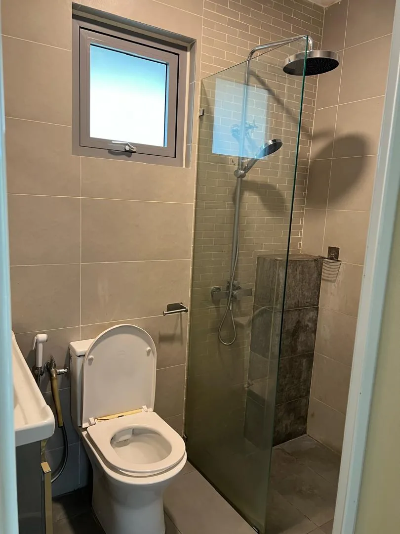 Beige tile rain shower glass screen
