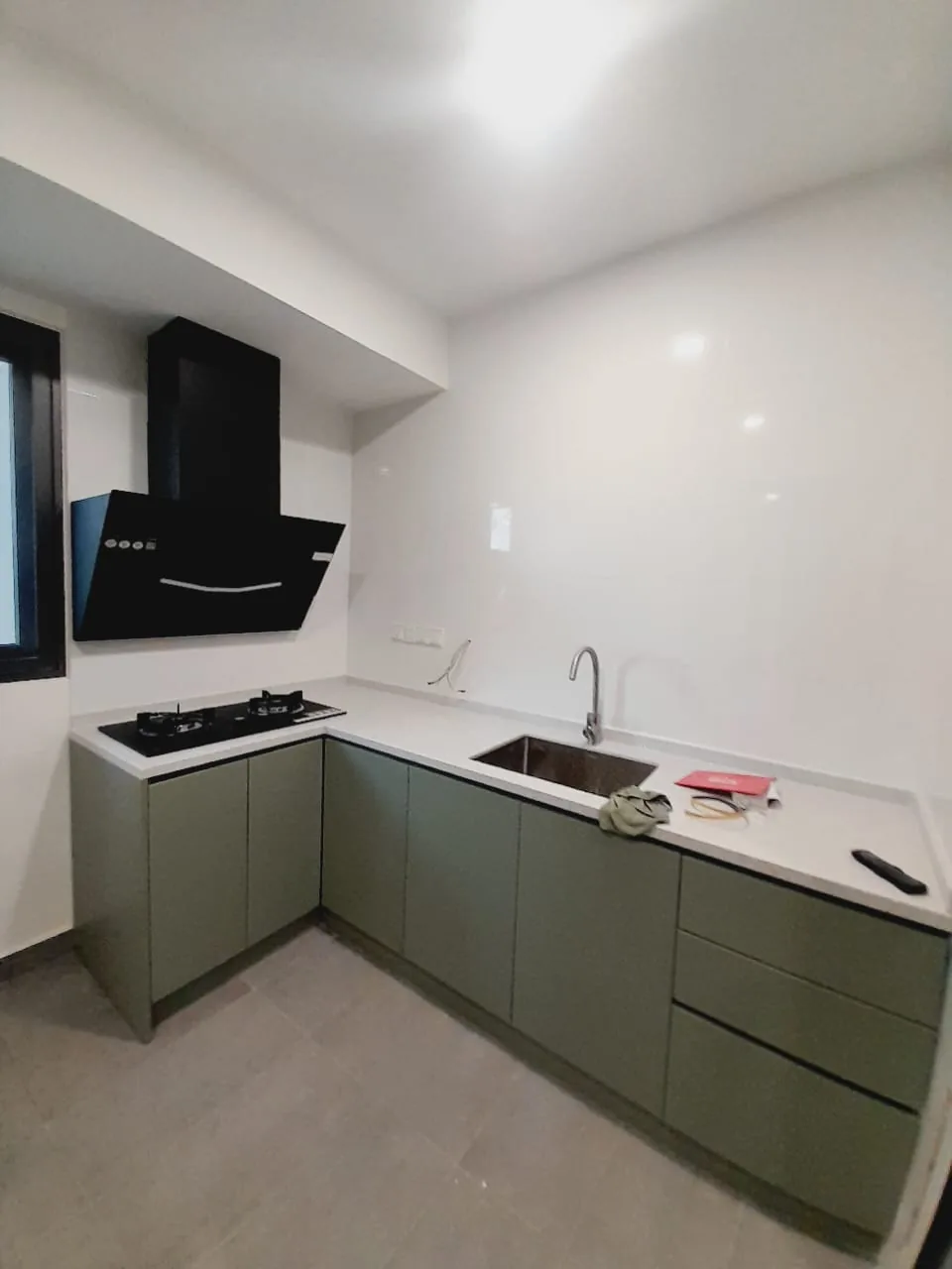 Process — Green l shaped kitchen black hood